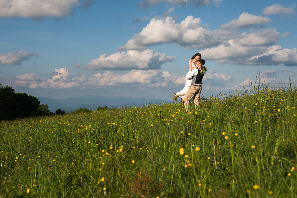 Relaxed elopement wedding day for a couple in the mountains with yellow wildflowers.