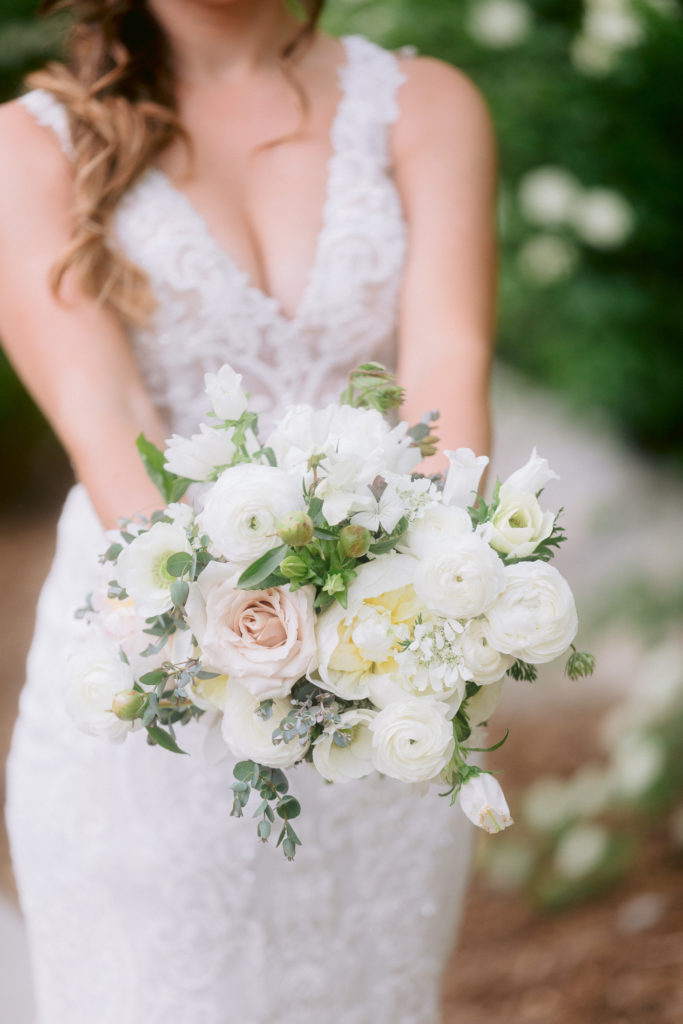 The bride's flowers were white with light pink and greenery.