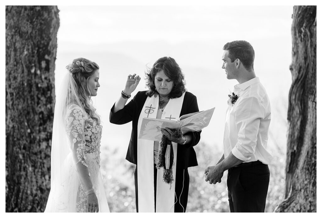 black and white photo of couple eloping