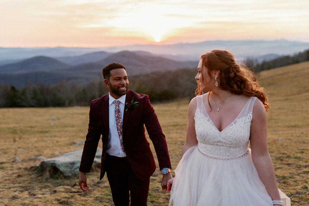 Couple Holding hands and walking at sunset