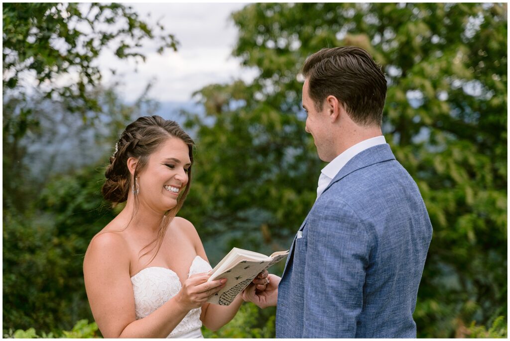 Sara laughing while reading her personal vows to Andrew.