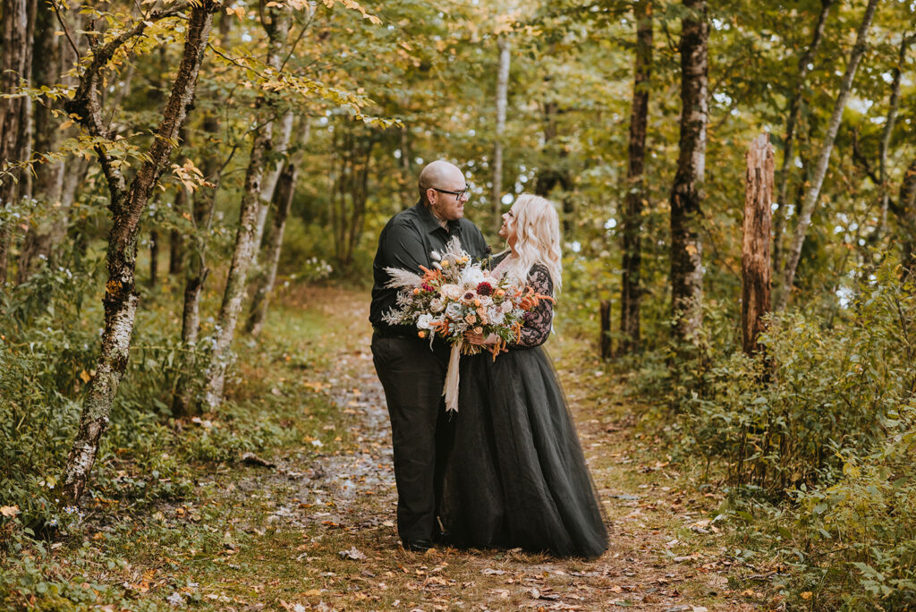 Large boho bridal bouquet for a black and orange elopement in the NC Mountains