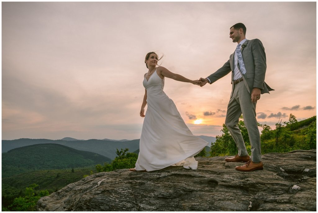 Sunset elopement on a cliff in the mountains of Asheville along the Blue Ridge Parkway.